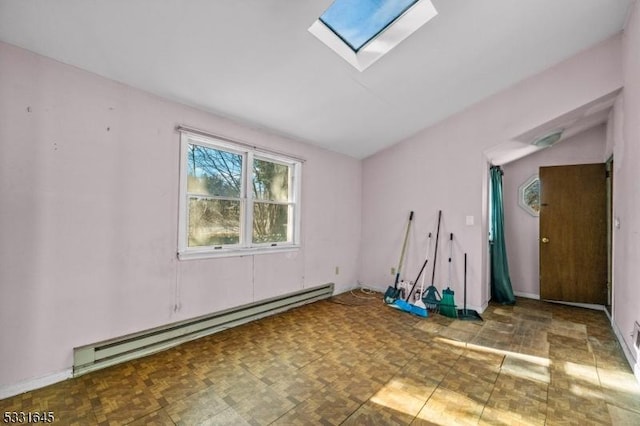 unfurnished room featuring parquet flooring, a baseboard radiator, and a skylight