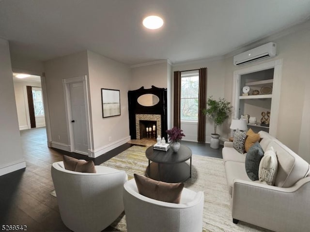 living room featuring wood-type flooring, ornamental molding, and a wall unit AC