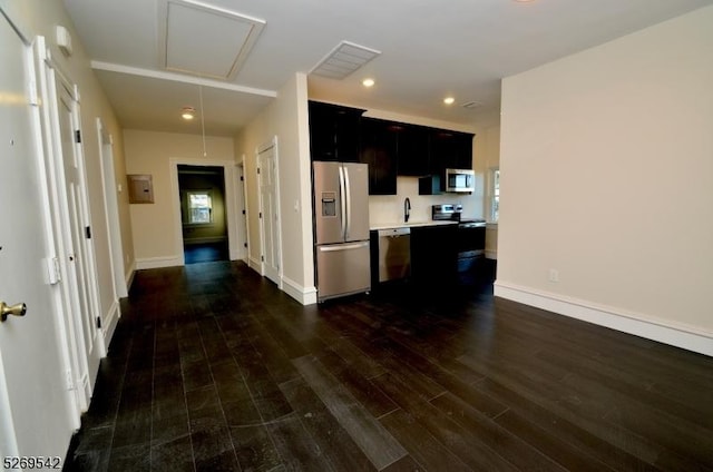 kitchen with dark hardwood / wood-style floors, sink, stainless steel appliances, and electric panel