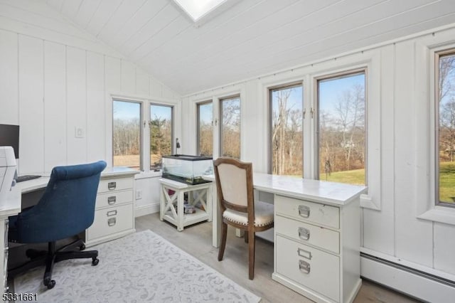 office space featuring wood walls, lofted ceiling, a baseboard heating unit, light wood-type flooring, and wood ceiling