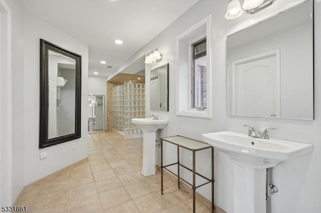 bathroom featuring tile patterned flooring and double sink