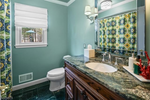 bathroom with ornamental molding, vanity, and toilet