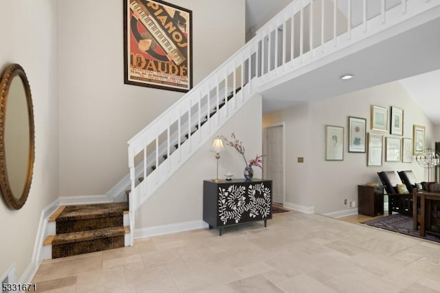 stairway with vaulted ceiling