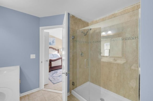 bathroom with tile patterned flooring, vanity, and a shower with door