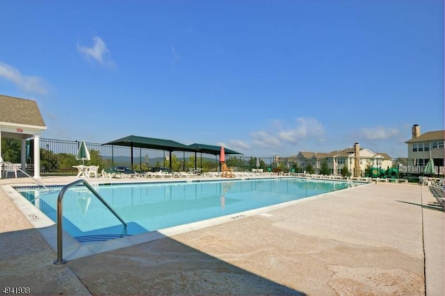 view of swimming pool with a patio