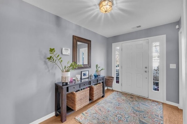 foyer entrance with light wood-type flooring