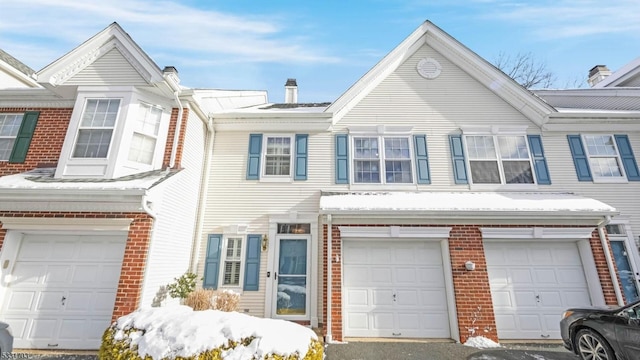 multi unit property featuring a garage