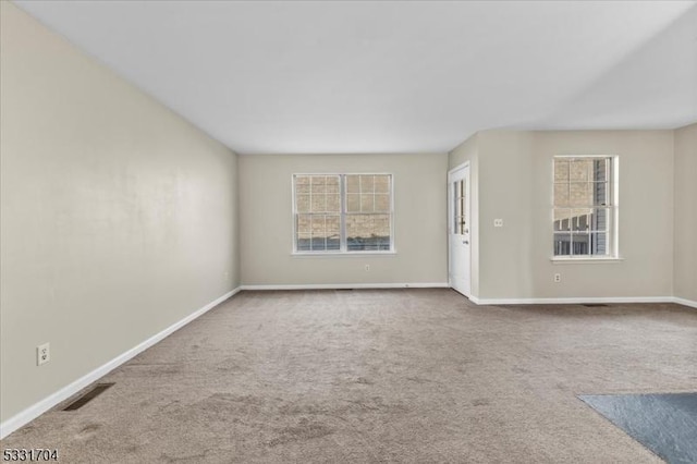 unfurnished room with carpet floors