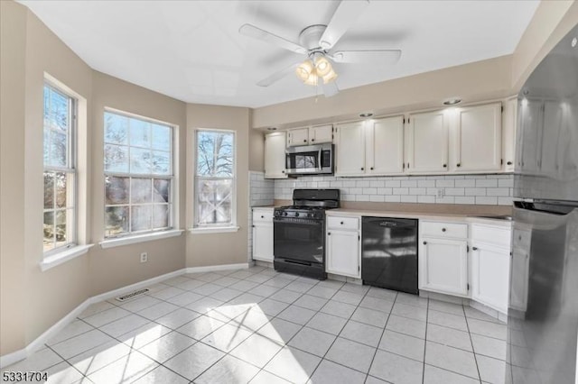 kitchen featuring ceiling fan, backsplash, white cabinets, and black appliances