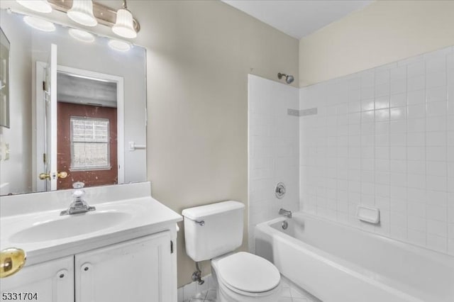 full bathroom featuring toilet, vanity, and tiled shower / bath