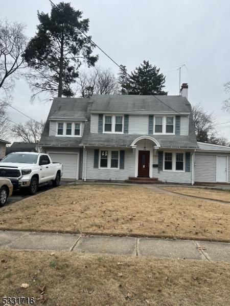 front facade with a garage