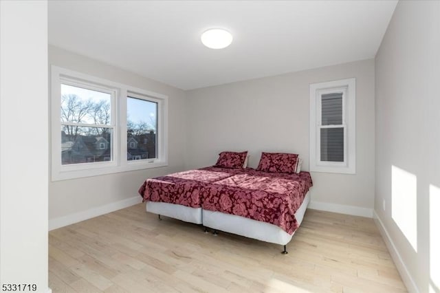 bedroom with light hardwood / wood-style flooring