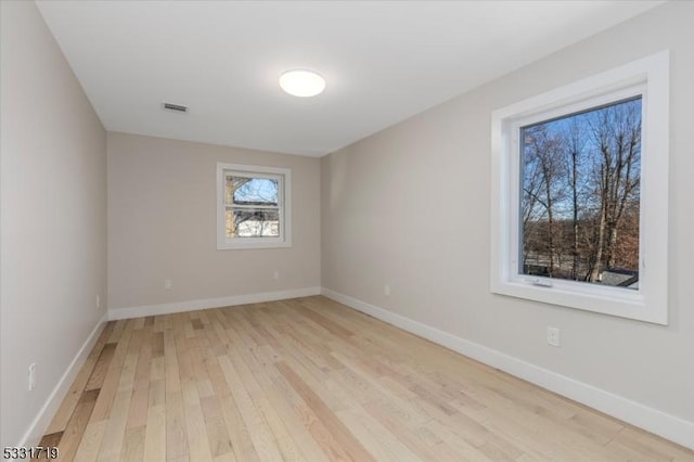 unfurnished room featuring light hardwood / wood-style floors