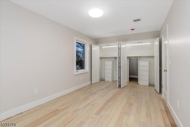 unfurnished bedroom with light hardwood / wood-style flooring