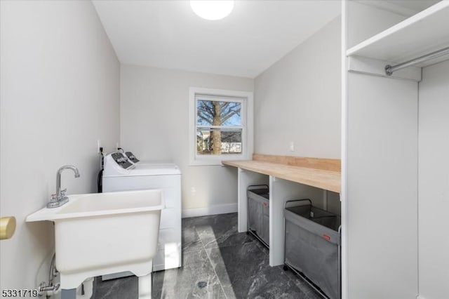 laundry room featuring sink and washing machine and clothes dryer