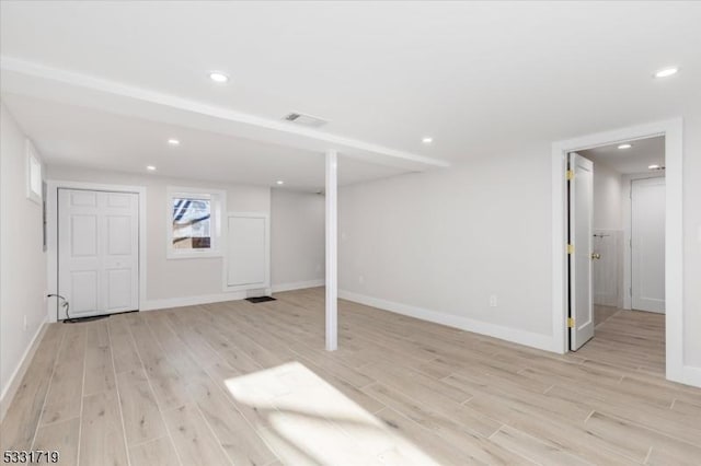 basement featuring light hardwood / wood-style flooring