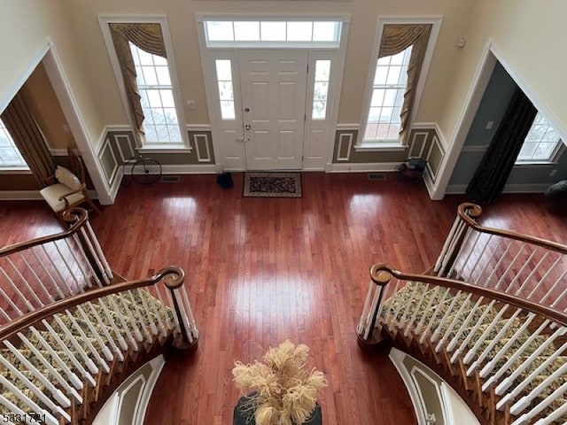 foyer with dark hardwood / wood-style flooring