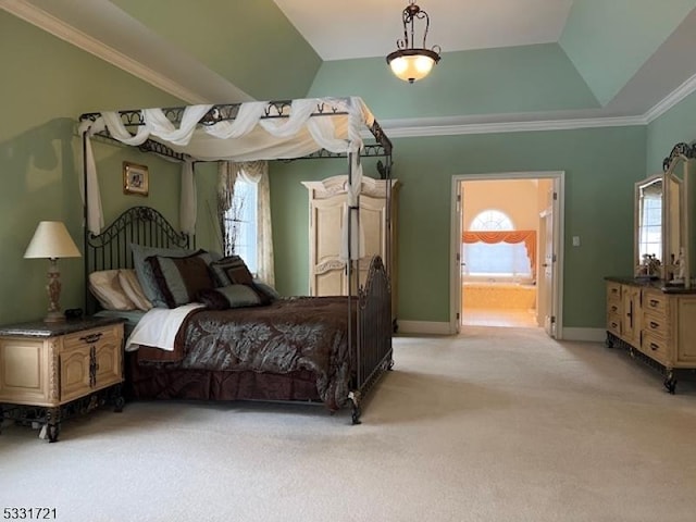 carpeted bedroom featuring lofted ceiling, connected bathroom, multiple windows, and crown molding