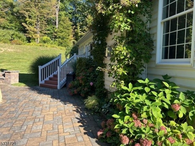 view of side of property with a patio