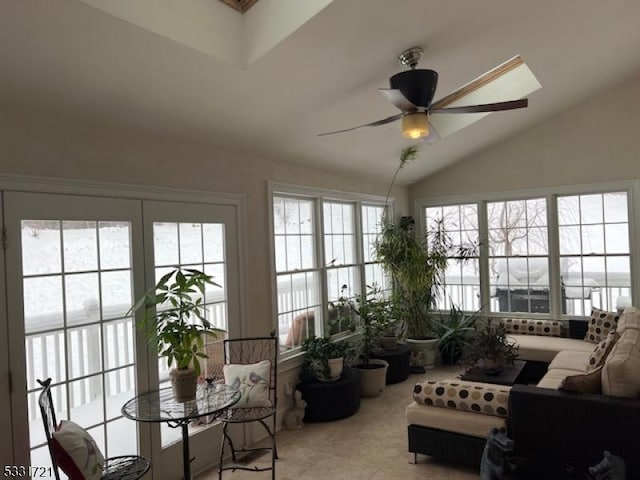 sunroom / solarium with ceiling fan and lofted ceiling