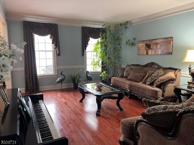 living room featuring a healthy amount of sunlight, ornamental molding, and hardwood / wood-style floors