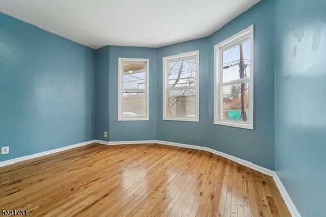 unfurnished room featuring light wood-type flooring