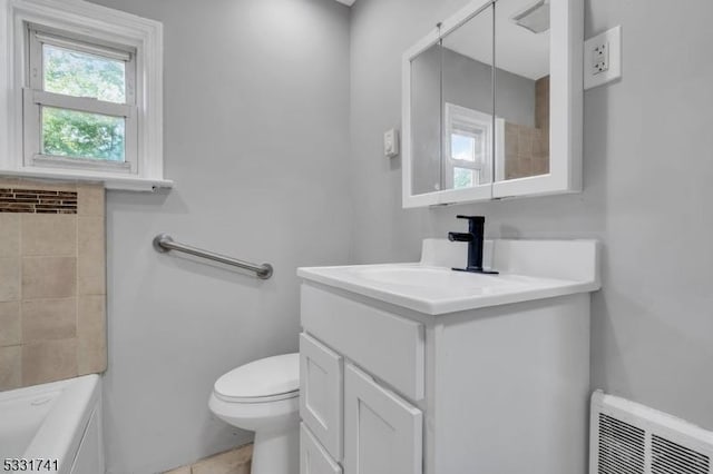 bathroom featuring toilet and vanity