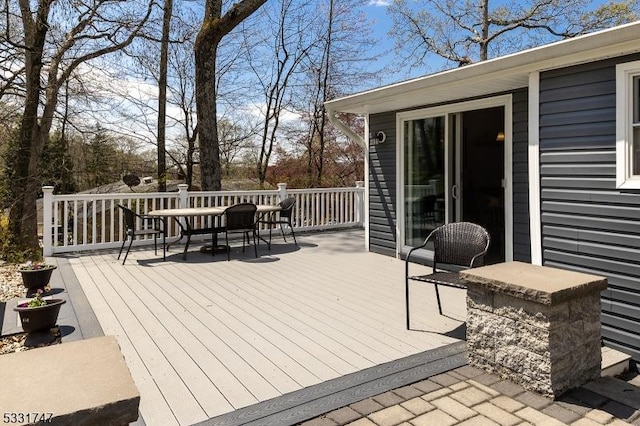 wooden deck featuring outdoor dining space