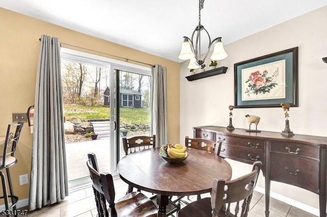 dining area featuring an inviting chandelier and light tile patterned floors