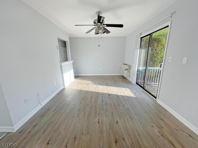 unfurnished living room with light hardwood / wood-style flooring and ceiling fan