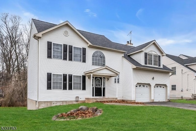 view of front facade featuring a garage and a front lawn