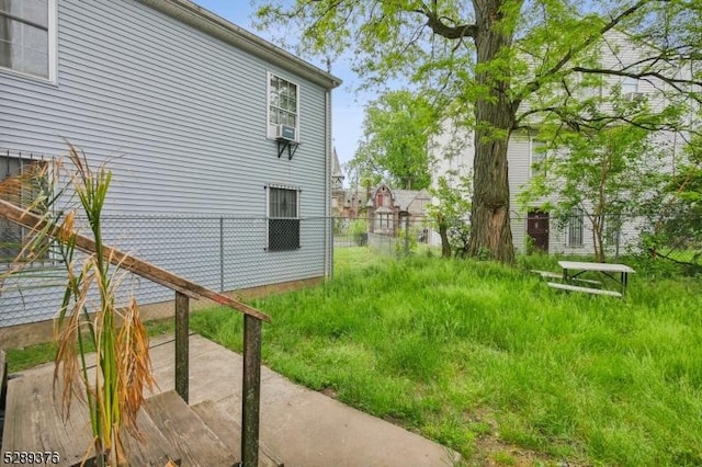 view of yard featuring cooling unit and a patio area