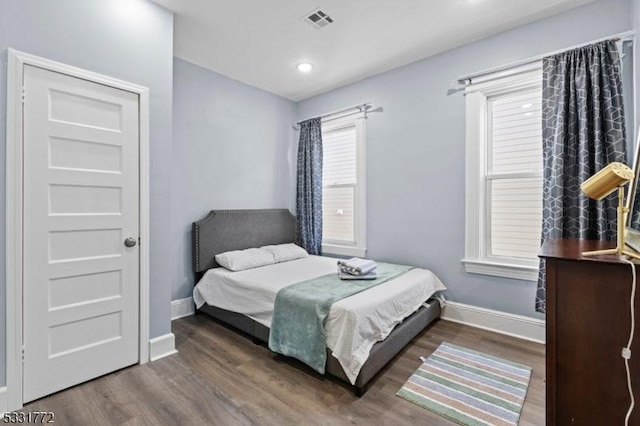 bedroom featuring dark wood-type flooring