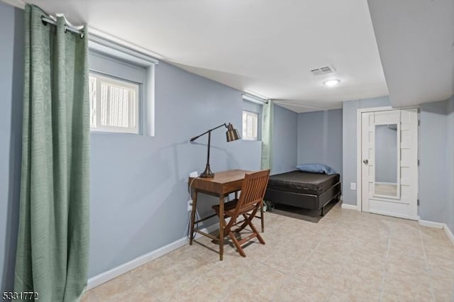 home office with light tile patterned flooring