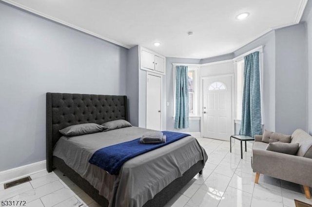 bedroom with ornamental molding