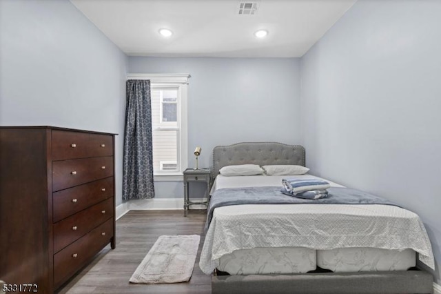 bedroom featuring hardwood / wood-style flooring