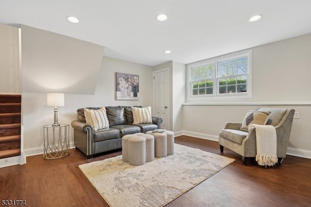 living area with baseboards, recessed lighting, stairs, and dark wood-type flooring