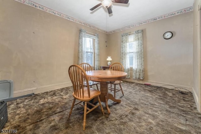 carpeted dining area featuring ceiling fan