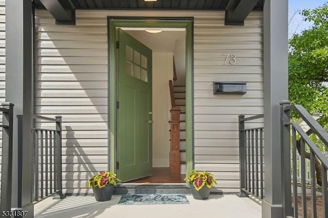 doorway to property featuring a porch