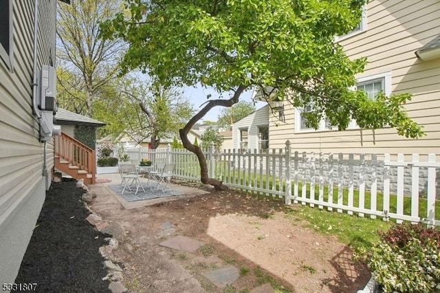 view of yard with a fenced backyard and a patio area