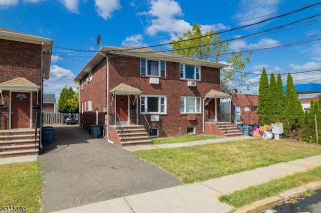 view of front of home with a front lawn