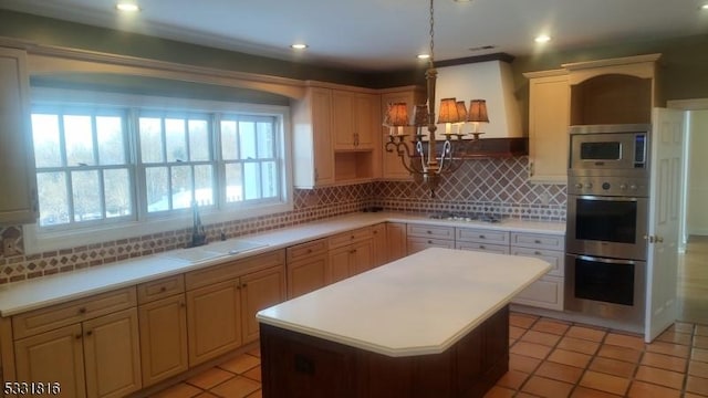 kitchen with light tile patterned flooring, sink, tasteful backsplash, a kitchen island, and stainless steel appliances