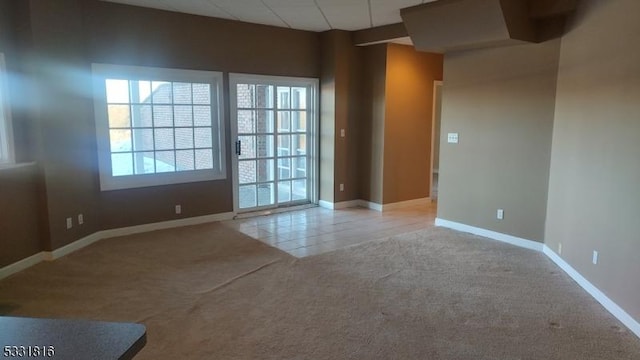 empty room featuring light colored carpet