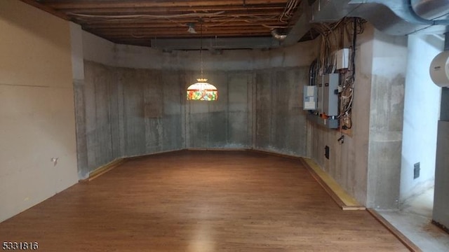 basement featuring wood-type flooring