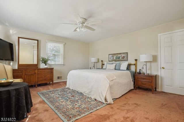 carpeted bedroom featuring ceiling fan