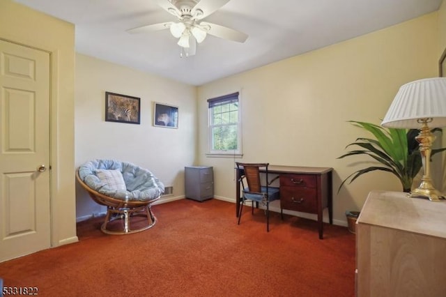 home office featuring ceiling fan and dark carpet