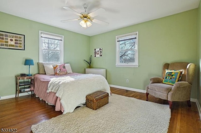 bedroom featuring ceiling fan and dark wood-type flooring