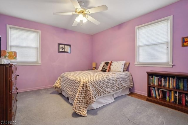 bedroom featuring ceiling fan and light colored carpet