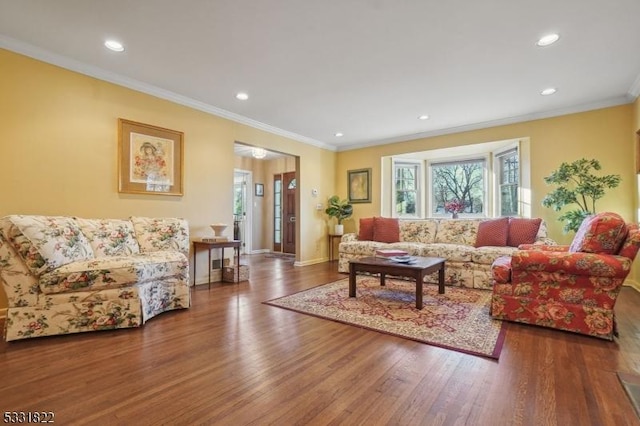 living room featuring ornamental molding and dark hardwood / wood-style floors