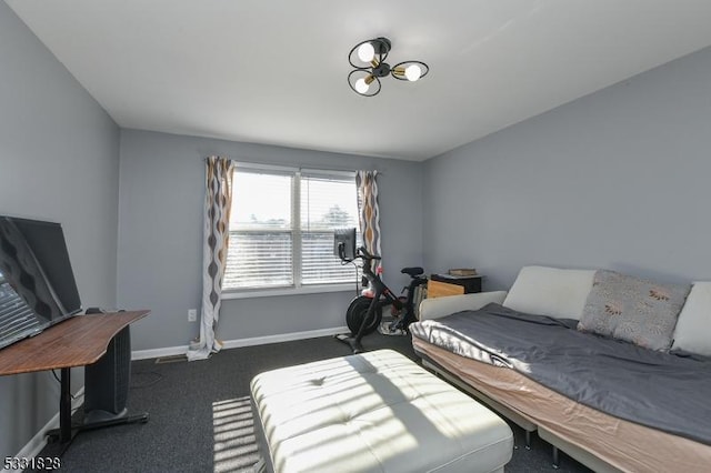 bedroom with dark colored carpet